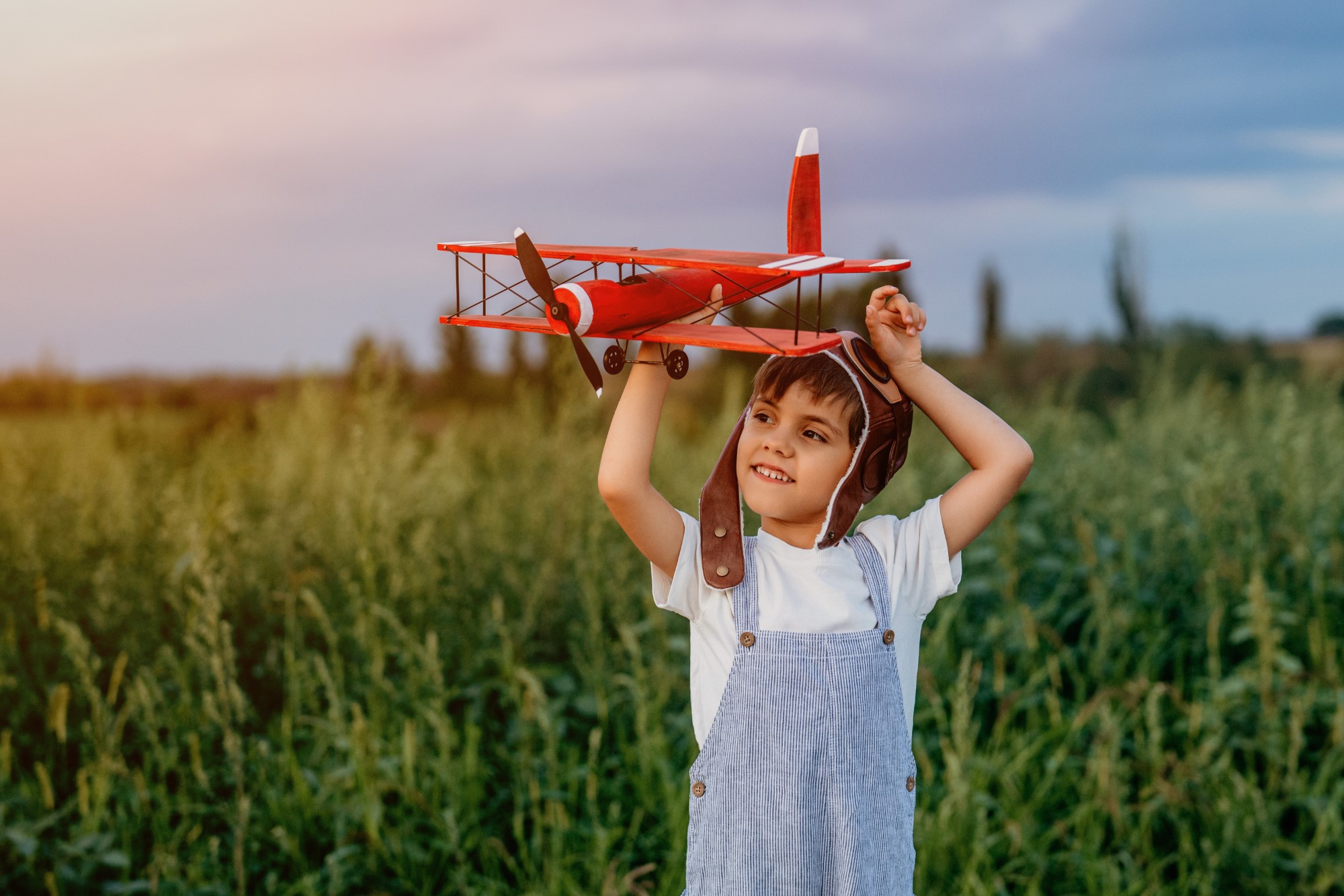 Curious 5 Years Old Preschool Child Boy Plays Craft Wooden Retro Styled Airplane